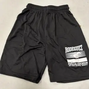 Black athletic shorts with white text and graphics on the side.