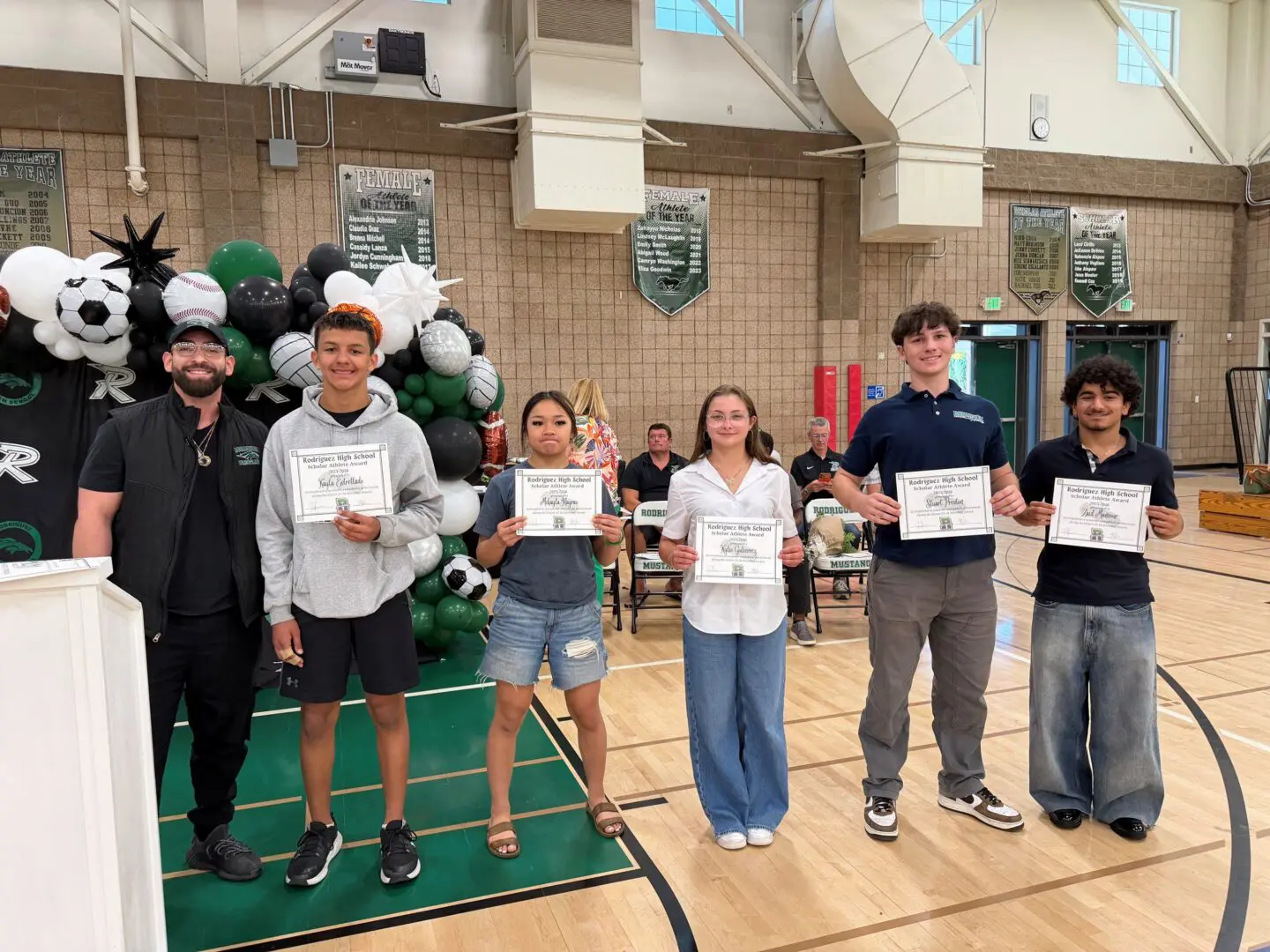 Students showing off their certificates