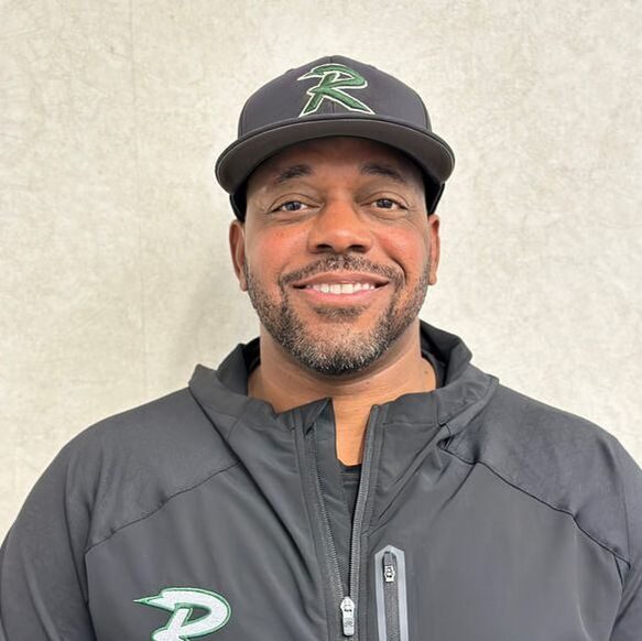 Person in black cap and jacket