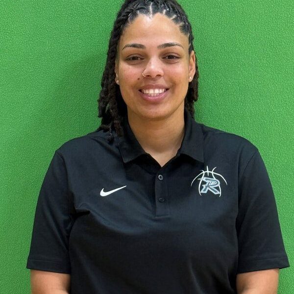 Woman standing against green background