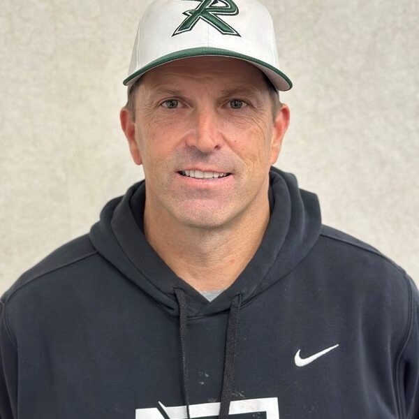 Smiling man wearing a sports cap